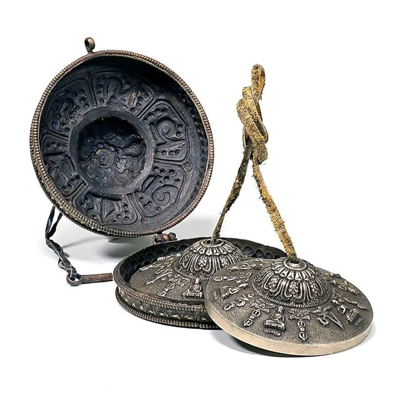 Címbalo tibetano com símbolos budistas